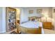 Bedroom with a wooden bed frame and a bookcase at 869 Ashford Way, Henderson, NV 89015
