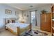 Bedroom with a wooden bed frame and a dresser at 869 Ashford Way, Henderson, NV 89015