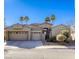 Beautiful home with three-car garage and desert landscaping at 869 Ashford Way, Henderson, NV 89015