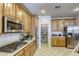 Kitchen boasts stainless steel appliances and walk-in pantry at 869 Ashford Way, Henderson, NV 89015
