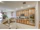 Well-equipped kitchen with stainless steel appliances and wooden cabinetry at 869 Ashford Way, Henderson, NV 89015