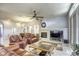 Open living area with fireplace, built-in entertainment center, and large windows at 869 Ashford Way, Henderson, NV 89015