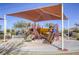 Modern playground with shade structure at 869 Ashford Way, Henderson, NV 89015