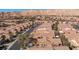 Aerial view of a large neighborhood with desert landscaping and mountain views at 1327 Beehive Ln, Mesquite, NV 89034