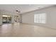 Bright living room with tile floors, ceiling fan and sliding doors at 1327 Beehive Ln, Mesquite, NV 89034