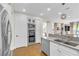 Modern kitchen with white cabinets, stainless steel appliances and double ovens at 1352 Fox Acres Dr, Las Vegas, NV 89134