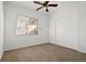 Bedroom with neutral carpet, closet, and window offering natural light at 23 Feather Sound Dr, Henderson, NV 89052