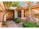 Inviting entryway with wooden door and landscaping at 23 Feather Sound Dr, Henderson, NV 89052