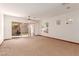 Bright living room with patio access and ceiling fan at 23 Feather Sound Dr, Henderson, NV 89052