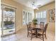 Charming breakfast nook with a round table and access to the backyard at 30 Fountainhead Cir, Henderson, NV 89052