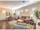 Living room with hardwood floors, comfortable seating, and large windows at 30 Fountainhead Cir, Henderson, NV 89052