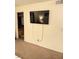 Bedroom featuring a mounted TV and wall-to-wall carpet at 3145 E Flamingo Rd # 1043, Las Vegas, NV 89121