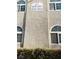 Building exterior featuring address numbers and arched windows at 3145 E Flamingo Rd # 1043, Las Vegas, NV 89121