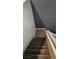 Brown carpeted staircase leading to the upper level at 3338 Commendation Dr, Las Vegas, NV 89117