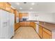 Kitchen boasts wood cabinets, granite counters and appliances at 3493 Lupine Bush Ct, Las Vegas, NV 89135