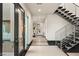 Bright entryway with modern staircase and stone flooring at 36 Rainbow Point Pl, Henderson, NV 89011