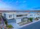 Modern home's exterior with lake view at 36 Rainbow Point Pl, Henderson, NV 89011