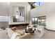 Modern living room with fireplace and large windows at 36 Rainbow Point Pl, Henderson, NV 89011