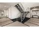 Modern staircase with metal railing and stone flooring at 36 Rainbow Point Pl, Henderson, NV 89011