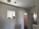 Upper hallway with bathroom and laundry access at 4043 Asante Cove St, Las Vegas, NV 89115