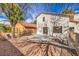Private backyard with patio and gravel landscaping at 5213 Tamanar Dr, Las Vegas, NV 89130