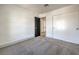 Well-lit bedroom with grey carpet and a closet at 5213 Tamanar Dr, Las Vegas, NV 89130