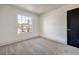 Spacious bedroom featuring grey carpet and a window with a view at 5213 Tamanar Dr, Las Vegas, NV 89130