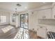 Sunlit dining area with sliding glass doors leading to patio at 5213 Tamanar Dr, Las Vegas, NV 89130
