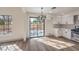 Bright dining area with sliding glass doors and chandelier at 5213 Tamanar Dr, Las Vegas, NV 89130