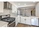 Updated kitchen boasts stainless steel appliances and white cabinetry at 5213 Tamanar Dr, Las Vegas, NV 89130