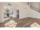 Open kitchen with white cabinets and stainless steel appliances at 5213 Tamanar Dr, Las Vegas, NV 89130