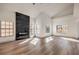 Living room with hardwood floors, fireplace, and large windows at 5213 Tamanar Dr, Las Vegas, NV 89130
