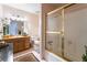 Bathroom with shower/tub, wood vanity, and rug at 6377 Concho Ln, Las Vegas, NV 89146