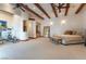 Spacious Primary bedroom with wood beams, exercise area, and access to backyard at 6377 Concho Ln, Las Vegas, NV 89146