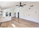 Open living room, featuring white cabinets and vinyl flooring at 6804 Atrium Ave, Las Vegas, NV 89108