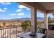 Relaxing patio features a table, chairs, and mountain views at 888 Ironwood Dr, Mesquite, NV 89027