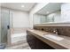 Modern bathroom with double sinks, large mirror, and shower at 912 Duckhorn Ct # 101, Las Vegas, NV 89144