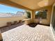 Covered patio with built-in grill and brick pavers at 917 Old Creek Way, North Las Vegas, NV 89084