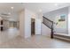 Bright living room featuring wood-look flooring, natural light and a stairway at 9333 Observatory St, Las Vegas, NV 89143