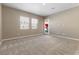 Spacious bedroom with neutral walls, carpet, and backyard access at 949 Twinflower Peak Ct, Las Vegas, NV 89138