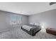 Spacious bedroom with carpeted floor and large window at 10122 Ashford Mill Ct, Las Vegas, NV 89178