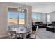 Bright dining area with table and chairs, view to backyard at 10122 Ashford Mill Ct, Las Vegas, NV 89178