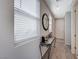 Bright entryway with a console table and decorative mirror at 10122 Ashford Mill Ct, Las Vegas, NV 89178