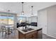 Island kitchen with granite counters, stainless steel appliances, and breakfast bar at 10122 Ashford Mill Ct, Las Vegas, NV 89178