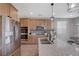 Updated kitchen with stainless steel appliances and granite countertops at 10122 Ashford Mill Ct, Las Vegas, NV 89178