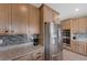 Kitchen with stainless steel appliances and light wood cabinets at 10122 Ashford Mill Ct, Las Vegas, NV 89178