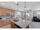 Modern kitchen with granite countertops and stainless steel appliances at 10122 Ashford Mill Ct, Las Vegas, NV 89178