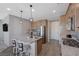 Eat-in kitchen featuring stainless steel appliances and an island at 10122 Ashford Mill Ct, Las Vegas, NV 89178