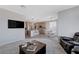 Open living room, kitchen, and dining area with modern finishes at 10122 Ashford Mill Ct, Las Vegas, NV 89178