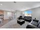 Open living room with neutral decor and comfortable seating at 10122 Ashford Mill Ct, Las Vegas, NV 89178